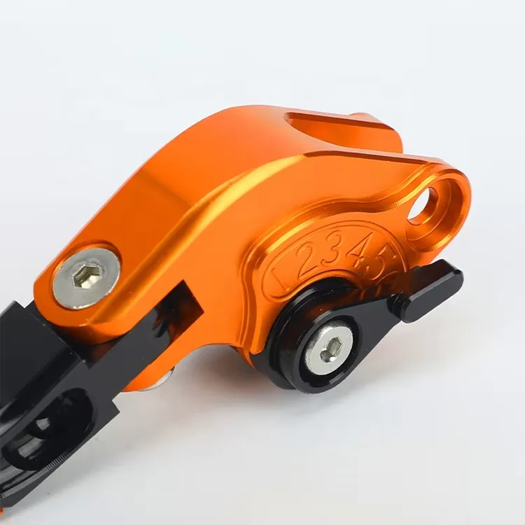 Custom CNC billet aluminum lever with orange anodizing